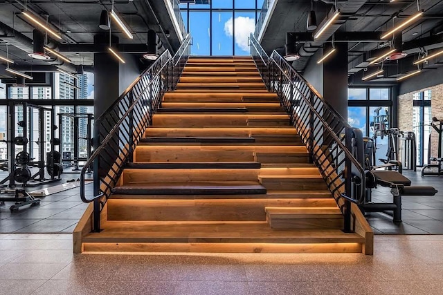 stairway with a towering ceiling