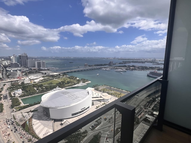 balcony with a view of city and a water view