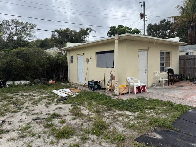 view of outbuilding with fence