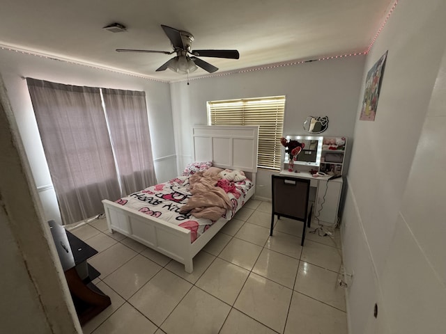 bedroom featuring a ceiling fan and light tile patterned flooring