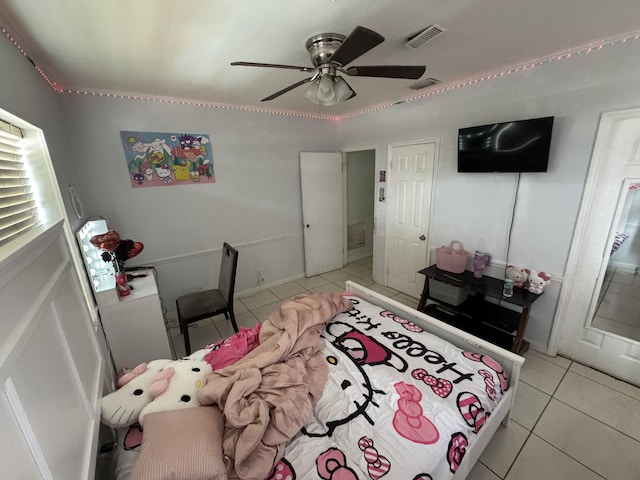 bedroom featuring ceiling fan, light tile patterned flooring, and visible vents