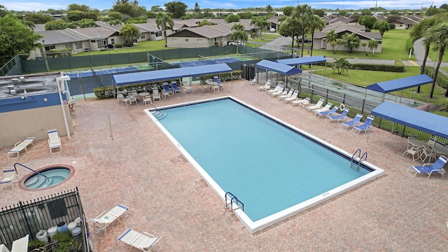 pool featuring a residential view and fence