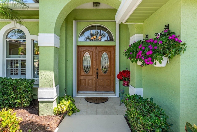 property entrance featuring stucco siding