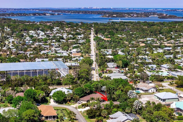 aerial view with a residential view and a water view