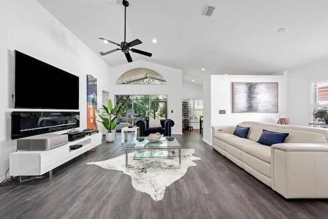 living room with high vaulted ceiling, visible vents, dark wood-style flooring, and recessed lighting