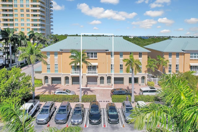 view of property featuring uncovered parking