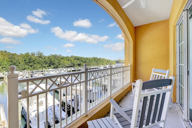 balcony featuring a water view