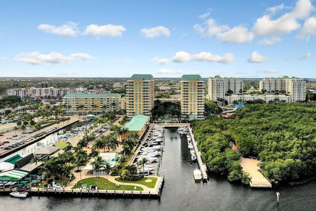 birds eye view of property featuring a water view and a view of city