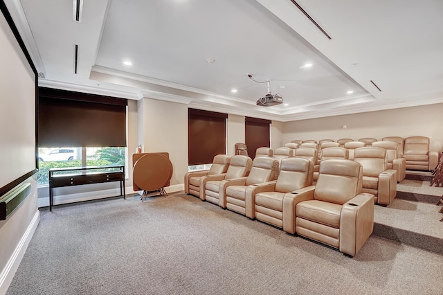 carpeted home theater room with baseboards, recessed lighting, a raised ceiling, and crown molding