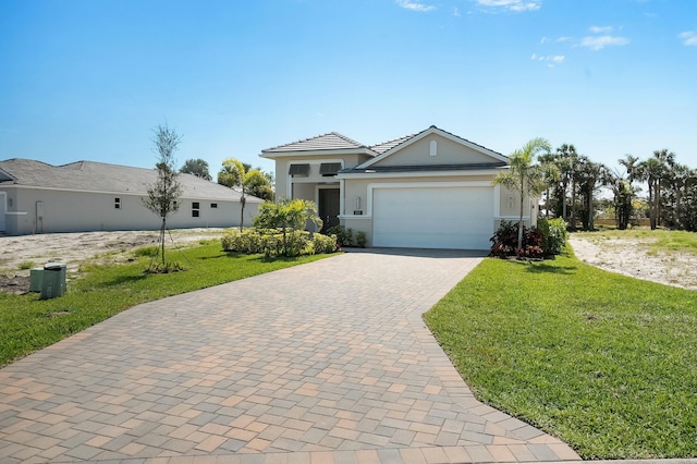 view of front of property with an attached garage, a front lawn, decorative driveway, and stucco siding