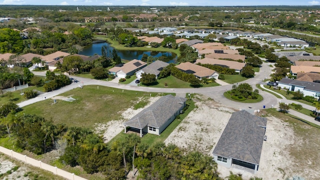 bird's eye view with a residential view and a water view