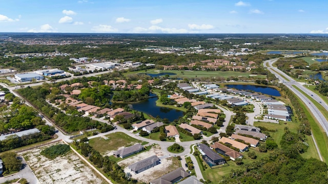 aerial view with a water view and a residential view