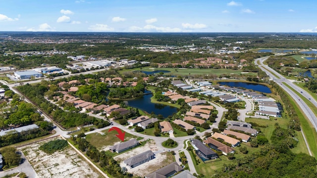 bird's eye view featuring a water view and a residential view