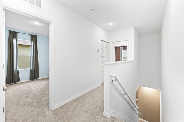 2349 SE Union Park Dr, Port Saint Lucie, FL 34952 - hallway featuring recessed lighting, baseboards, an upstairs landing, and light carpet