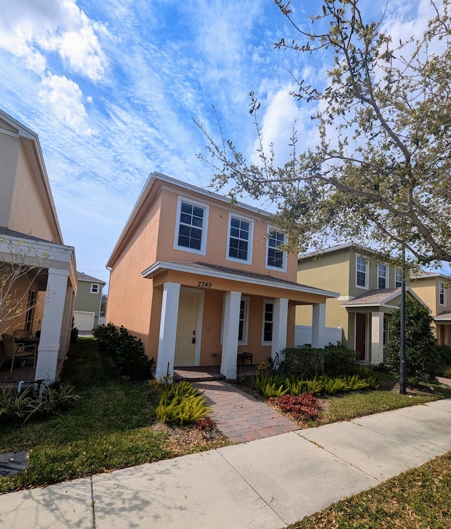 view of front of home with covered porch and stucco siding