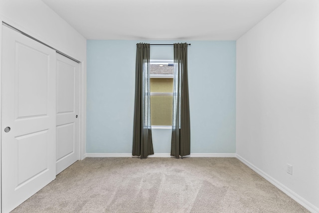 2349 SE Union Park Dr, Port Saint Lucie, FL 34952 - unfurnished bedroom featuring a closet, baseboards, and carpet floors