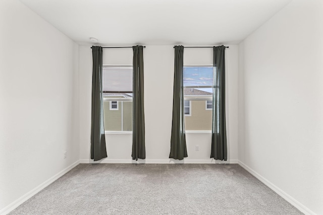 2349 SE Union Park Dr, Port Saint Lucie, FL 34952 - carpeted spare room featuring baseboards