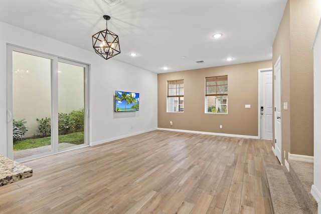 2349 SE Union Park Dr, Port Saint Lucie, FL 34952 - interior space with light wood-style flooring, recessed lighting, a chandelier, and a healthy amount of sunlight