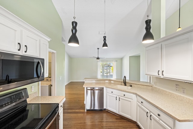 kitchen with a sink, white cabinetry, and stainless steel appliances