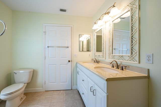 full bathroom featuring tile patterned floors, toilet, visible vents, and a sink