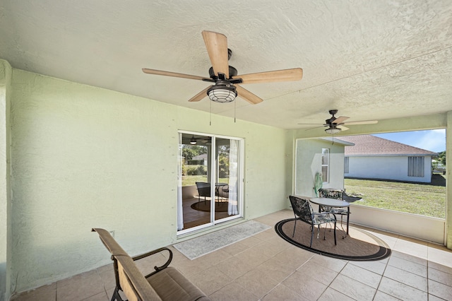 view of patio featuring ceiling fan