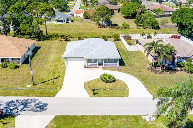 birds eye view of property with a residential view