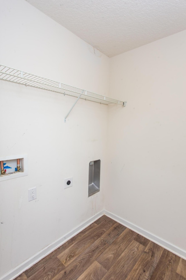 laundry area with hookup for an electric dryer, dark wood-type flooring, baseboards, laundry area, and washer hookup
