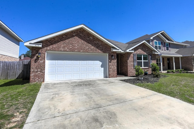 view of front facade featuring a front lawn, fence, and brick siding