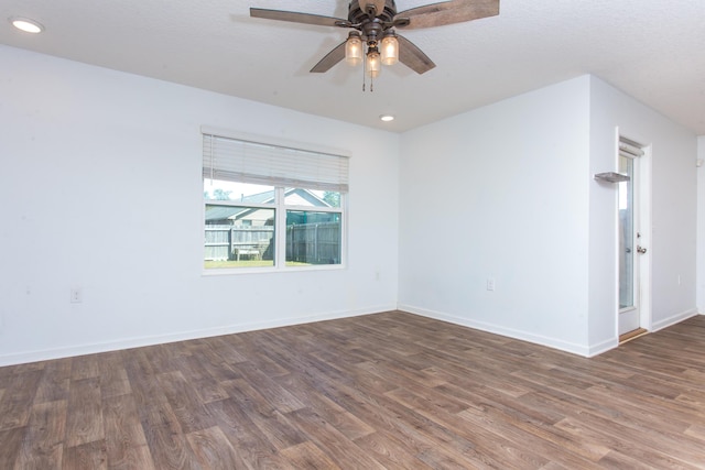 empty room featuring baseboards, ceiling fan, wood finished floors, and recessed lighting