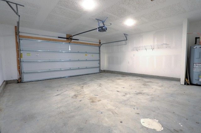 garage featuring a garage door opener and electric water heater