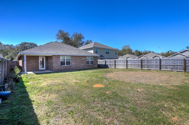 view of yard featuring a fenced backyard