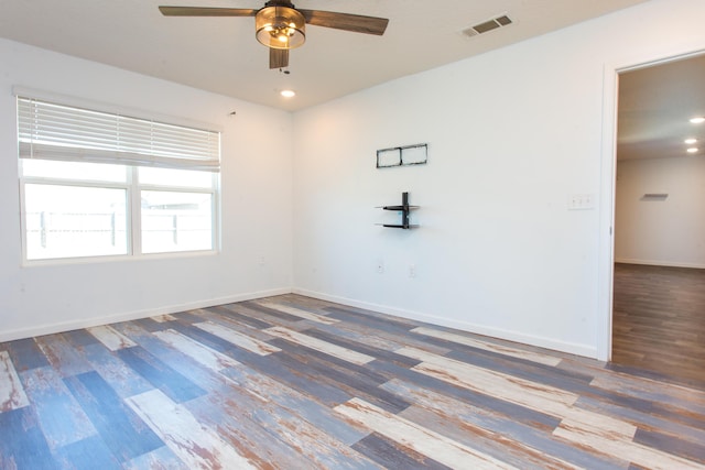 empty room with visible vents, baseboards, wood finished floors, recessed lighting, and a ceiling fan
