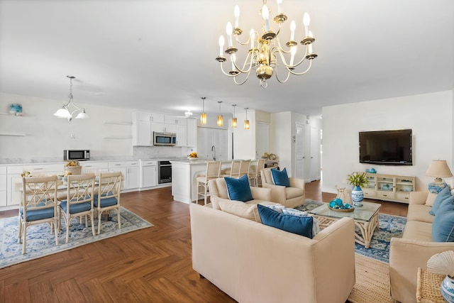 living area featuring an inviting chandelier