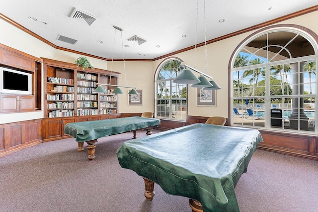 rec room featuring carpet floors, visible vents, and crown molding