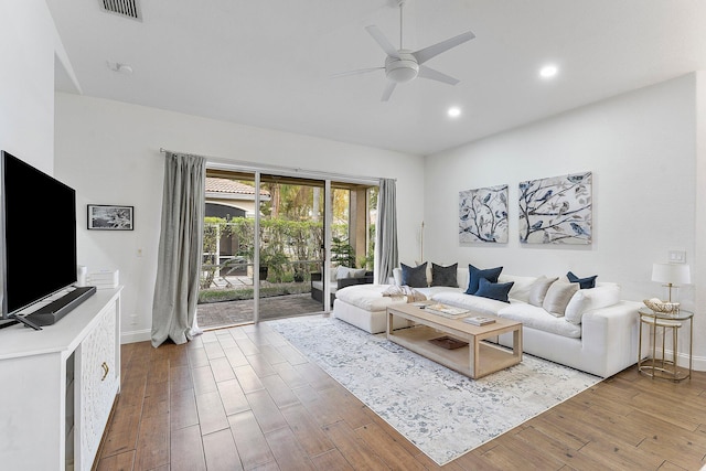 living room with recessed lighting, visible vents, ceiling fan, and wood finished floors