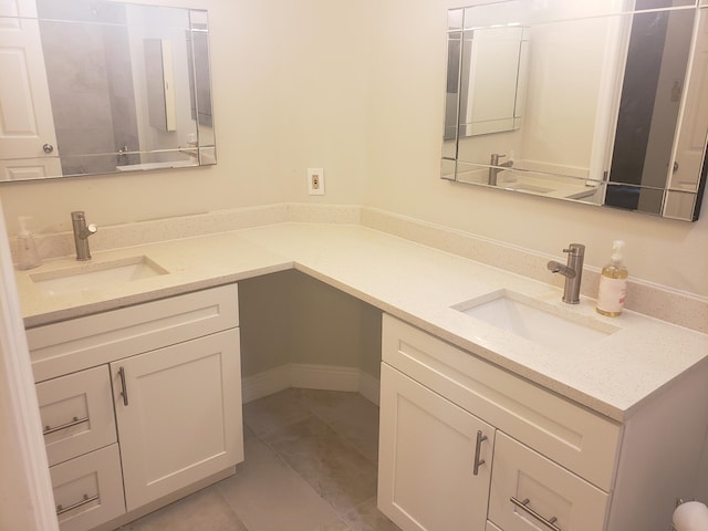 bathroom with tile patterned flooring and vanity