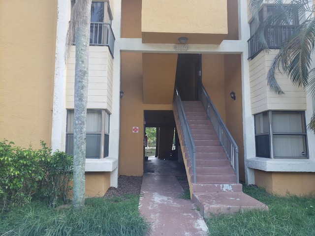 view of exterior entry with stucco siding