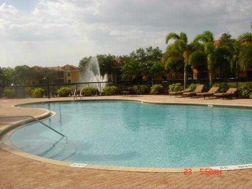 community pool featuring fence