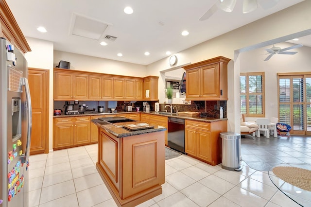 kitchen with tasteful backsplash, a ceiling fan, a kitchen island, stainless steel refrigerator with ice dispenser, and dishwasher