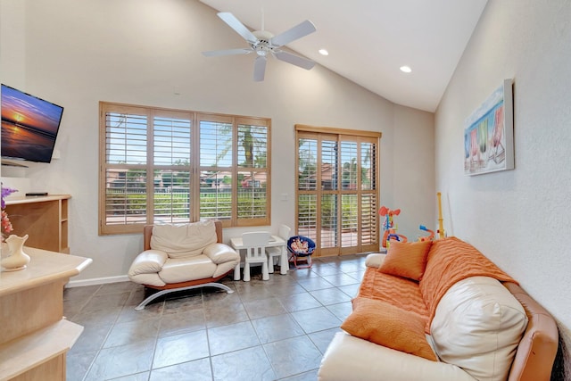 tiled living room with baseboards, high vaulted ceiling, recessed lighting, and a ceiling fan
