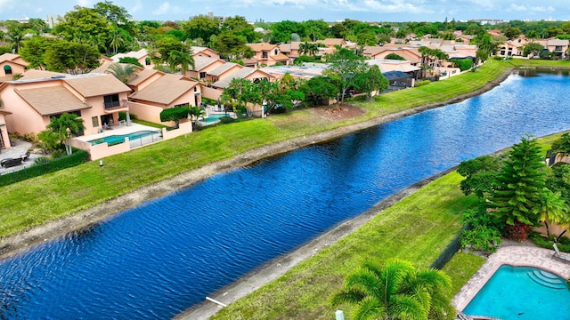 bird's eye view with a residential view and a water view