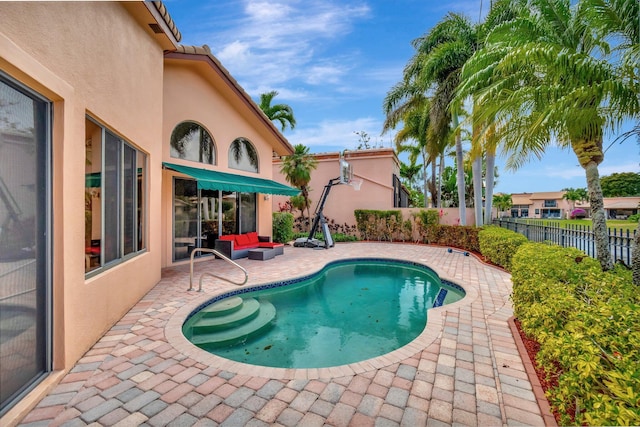 view of swimming pool featuring a fenced in pool, a patio area, and a fenced backyard