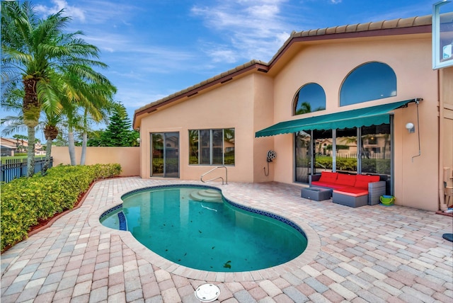 view of swimming pool with a patio area, fence, and a fenced in pool