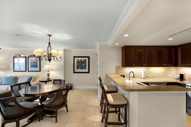 kitchen featuring light stone countertops, baseboards, decorative backsplash, and crown molding