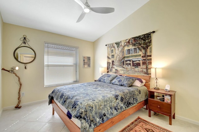 tiled bedroom with lofted ceiling, ceiling fan, and baseboards