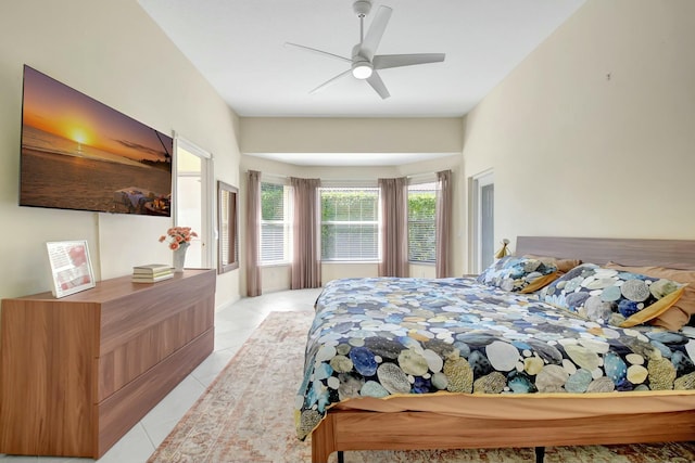 bedroom featuring light tile patterned flooring and a ceiling fan