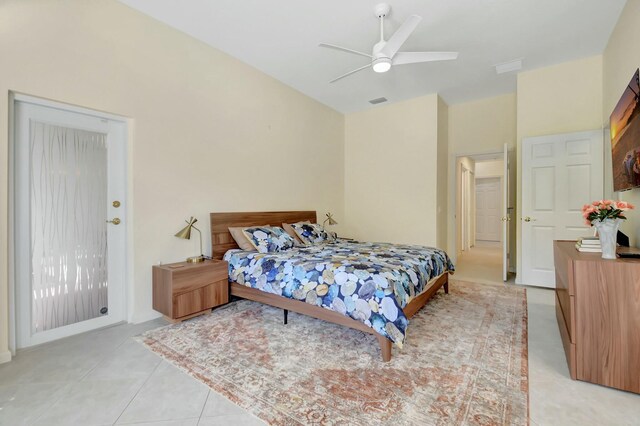 bedroom featuring ceiling fan, visible vents, and light tile patterned flooring