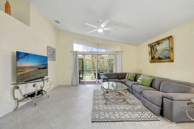 living area featuring visible vents, ceiling fan, and light tile patterned floors