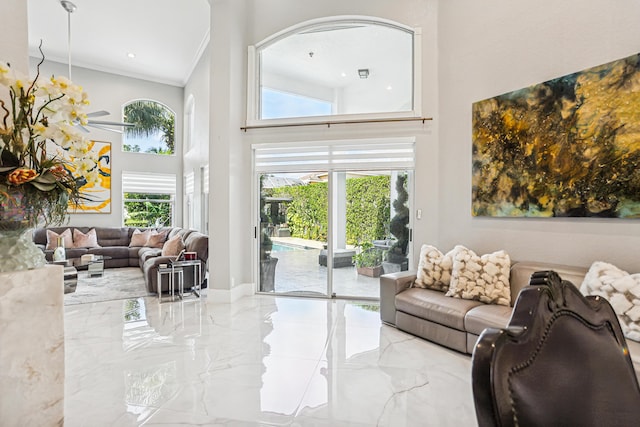 21741 Westmont Ct, Boca Raton, FL 33428 - living area featuring a towering ceiling, marble tiled flooring, and ornamental molding