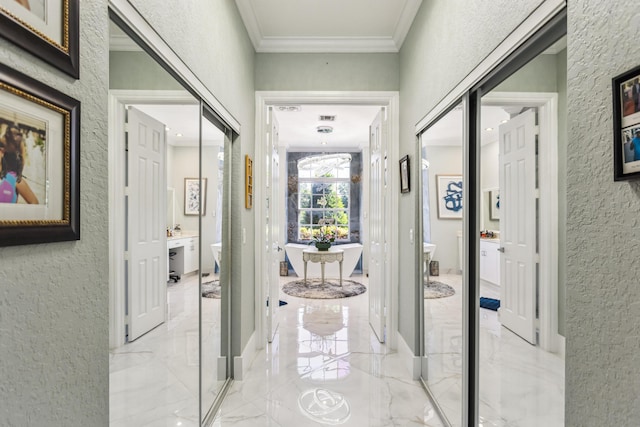 21741 Westmont Ct, Boca Raton, FL 33428 - corridor featuring a textured wall, light marble finish flooring, and ornamental molding